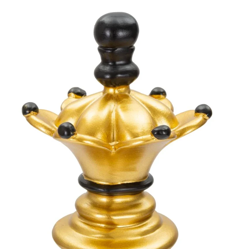 Pièce d’échecs dorée et noire (sculpture moderne)